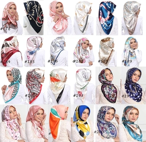 Collage of 24 vintage chain print satin silk headscarves showing diverse patterns
