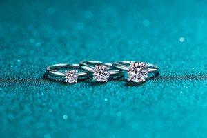Macro view of classic S925 sterling silver moissanite rings in three carat sizes