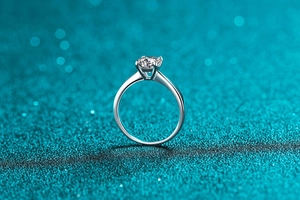 Macro shot of silver S925 ring featuring a classic six-prong moissanite diamond setting