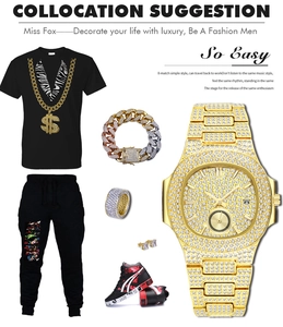 Detail of a luxury gold iced-out men's watch paired with street style fashion apparel
