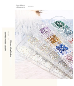 Macro detail of multi-grid nail art storage box with colorful flatback rhinestones and pearls