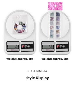 Detail view of 12-grid nail art rhinestones in round and rectangular boxes on a scale