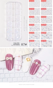 Detail of multi-size 1.5-4mm iridescent white nail art pearls in a 12-slot storage box