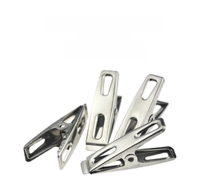 Close-up of flat stainless steel clips with solid spring mechanism for clothes hanging