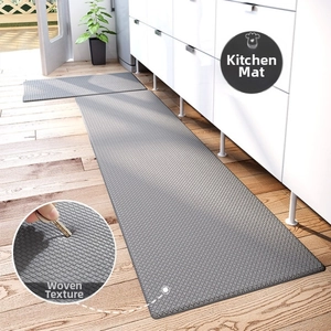 Detail of grey PU leather kitchen mats set featuring non-slip woven texture on wood floor