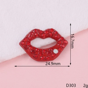 Macro detail of a 24.9mm sparkling red rhinestone lip accessory for DIY phone case making