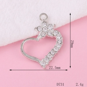 Macro detail of a 29mm silver heart crown pendant with sparkling crystal rhinestones