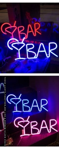 Macro detail of BAR neon sign with cocktail glass shape for ambient pub wall decor