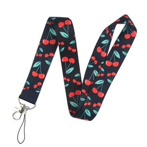 Detail of dark blue polyester lanyard with red cherry print and metal lobster clasp