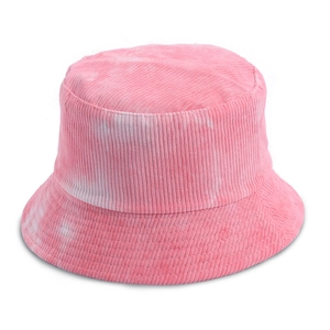 Detailed close-up of pink and white tie-dye corduroy fabric texture on a bucket hat
