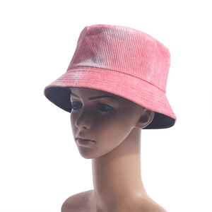 Detail of pink tie-dye corduroy bucket hat showing texture and multi-row brim stitching