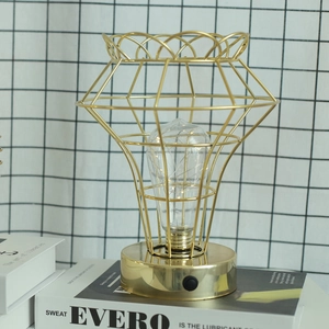 Golden iron geometric diamond table lamp with LED fairy lights and circular metal base