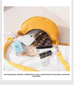 Macro view of bright yellow faux crocodile skin bag showing spacious interior capacity