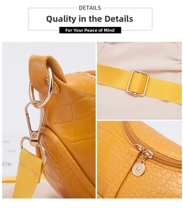 Detail of yellow crocodile pattern texture with gold hardware and woven strap