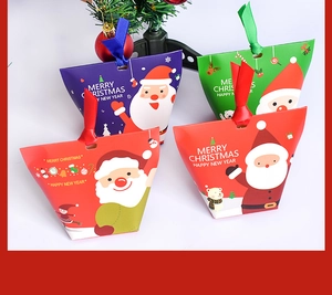 Christmas gift boxes with silk ribbon handles in red, green, purple and orange colors