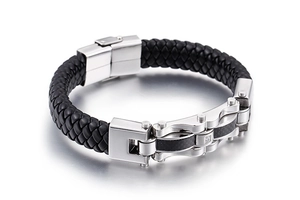 Close-up of black braided leather bracelet with stainless steel carbon fiber clasp