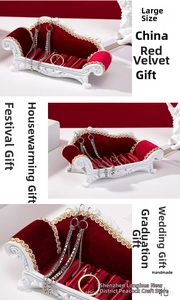 Macro shot of large red velvet sofa jewelry display stand with white embossed frame