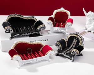 European vintage jewelry display set featuring miniature sofa and armchair for rings