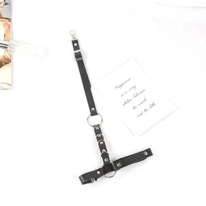 Detail of Harajuku punk leg garter with black PU leather, silver metal rings and rivets