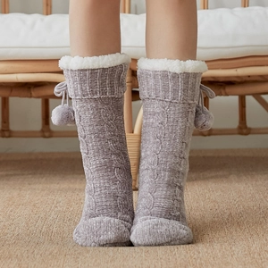 Grey thick plush house socks with white faux fur trim and pom-pom drawstrings