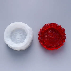 Detail view of a silicone skull mold and red resin finish for DIY ashtray craft projects