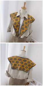 Front and back view of a yellow knitted faux collar with grey floral patterns