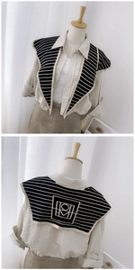 Front and back detail of a black and white striped knitted shawl collar for women