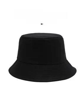 Close-up of a minimalist black cotton canvas bucket hat with a stylish flat top design