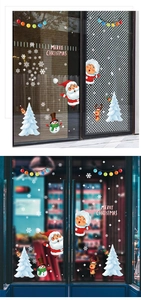 Detail of Santa and reindeer window stickers applied on glass door for Christmas decor