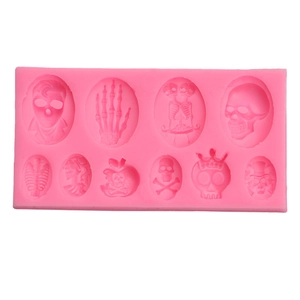 Pink 12-cavity Halloween silicone mold featuring various skulls and gothic bone designs