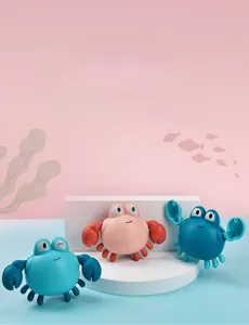 Three colorful wind-up crab bath toys floating on water for baby swimming fun