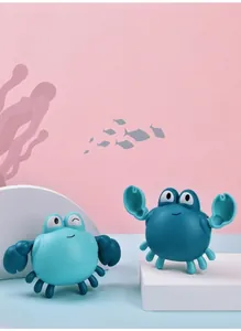 Close-up of cute cartoon wind-up crab bath toys in light and dark blue colors
