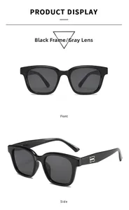 Detail view of square black sunglasses featuring silver metal logo on the temple