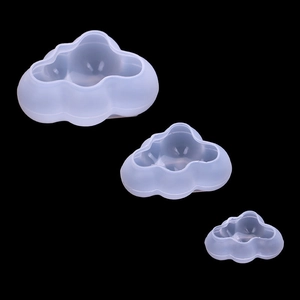 Three translucent white silicone cloud molds in different sizes for 3D cake decorating