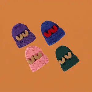 Chic winter knitted hats with deer antlers in purple, blue, pink and dark green colors