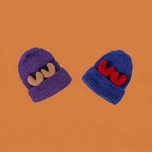 Thick knit winter hats with antler decor in purple and royal blue for warmth