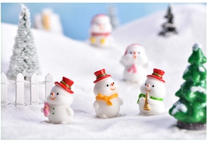 Three mini resin Christmas snowmen with red hats and colorful scarves for DIY terrariums
