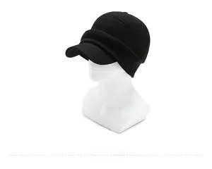 Detailed side view of black knitted winter earflap hat for men with a warm peak brim