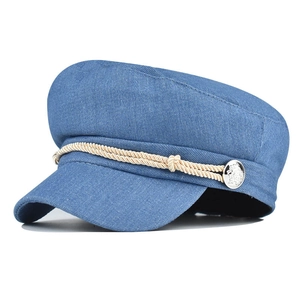 Blue corduroy newsboy cap for women with beige braided rope and silver metal buttons