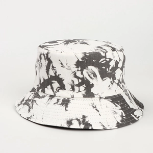 Detail showing high-quality black and white tie-dye pattern on a cotton bucket hat