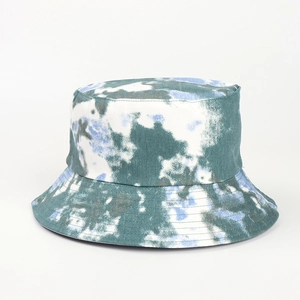 Detailed view of the vibrant blue tie-dye pattern on this reversible cotton bucket hat