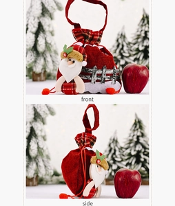 Front and side view of red burlap Christmas Santa gift bag with snowy forest background