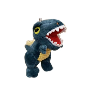 Deep blue plush dinosaur keychain with yellow back fins and a white rope strap