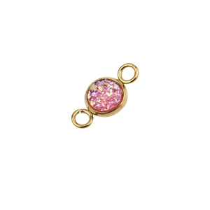 Macro view of 6mm vacuum gold-plated stainless steel connector with pink sparkly stone