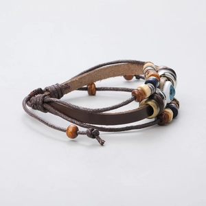 Close-up of multilayer leather bracelet with evil eye bead and turquoise accents