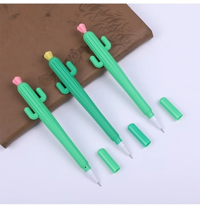Close-up of three cute cactus-shaped gel pens with pink and yellow flowers on a desk