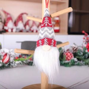 Handmade Christmas gnome ornaments with red knitted hats and long white fur beards
