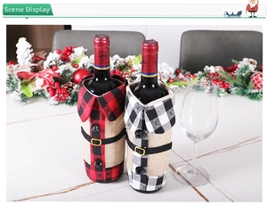 Detail of red and black buffalo plaid wine bottle covers with mini collars and belts