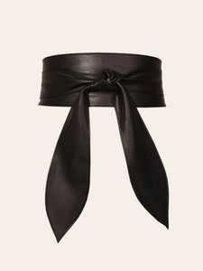 Detail of elegant black faux leather wrap obi belt showing smooth texture and tie closure
