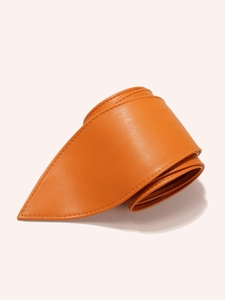 Detailed macro view of orange lychee grain leather waist belt with thick stitching